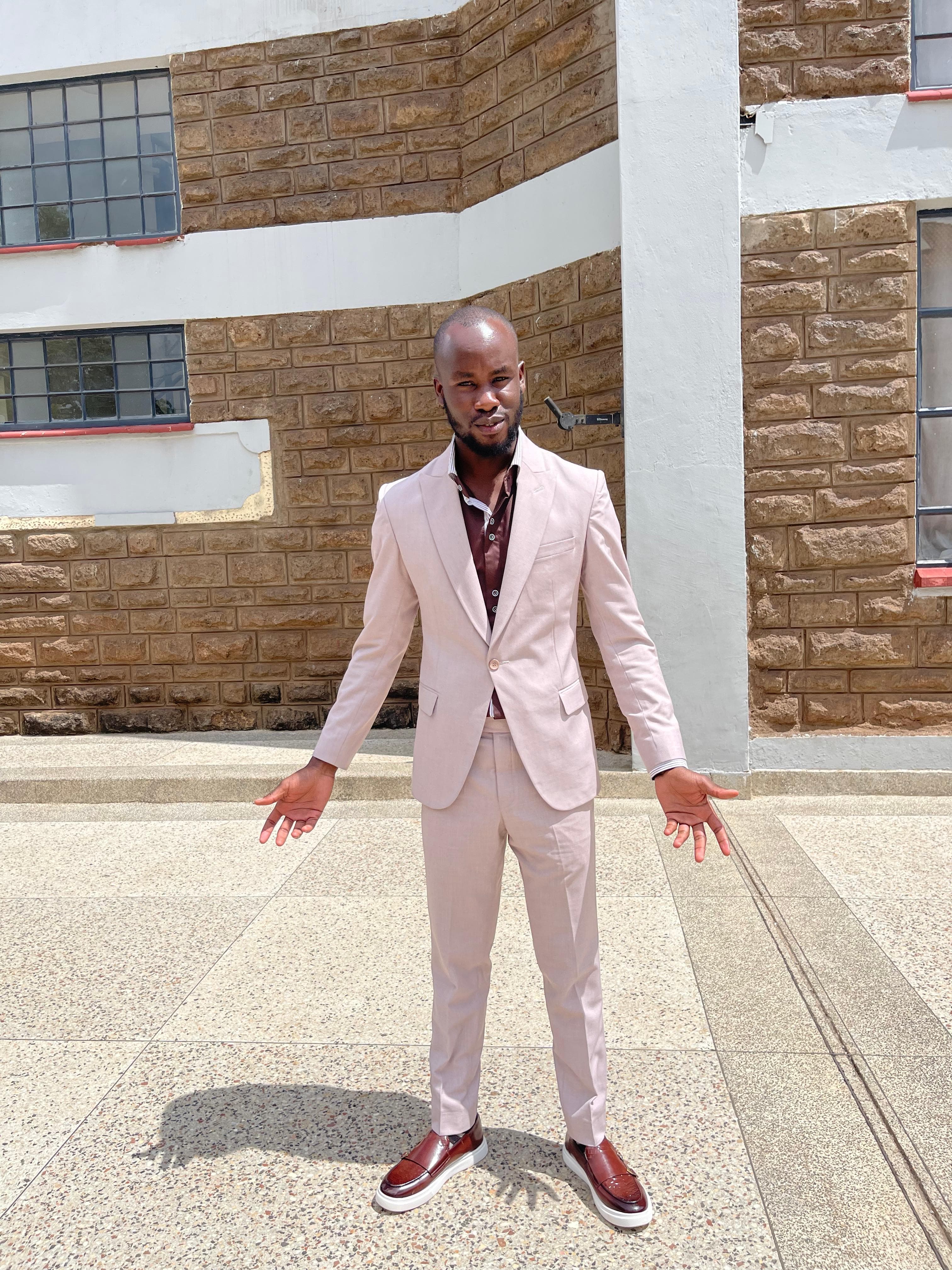 Pale bespoke suit by Dulo Attires